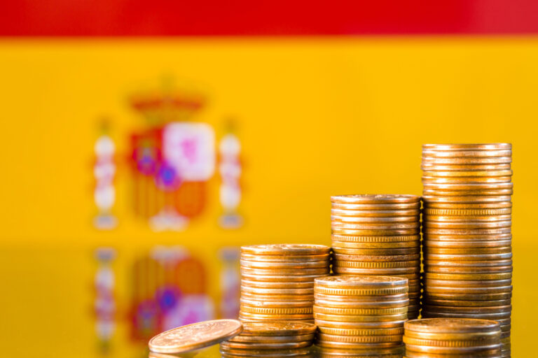 A,Stack,Of,Gold,Coins,On,The,Background,Of,The