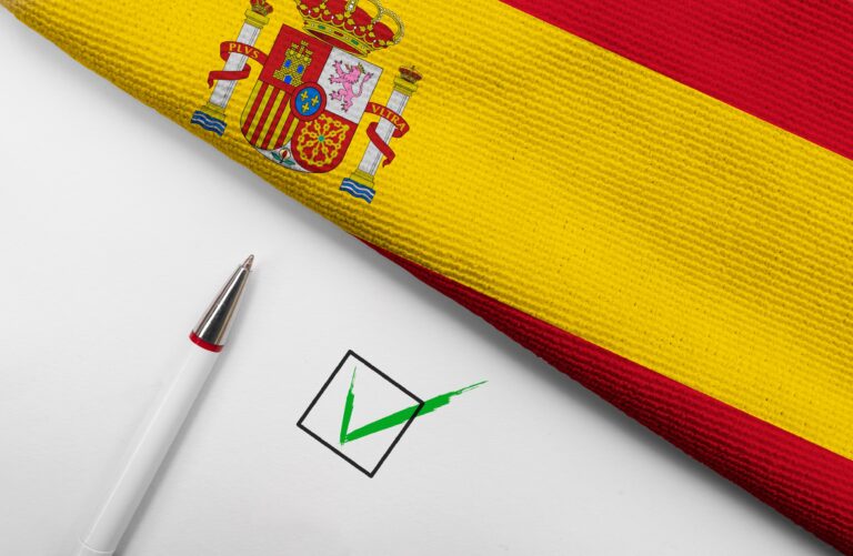 Pencil,,Flag,Of,Spain,And,Check,Mark,On,Paper,Sheet