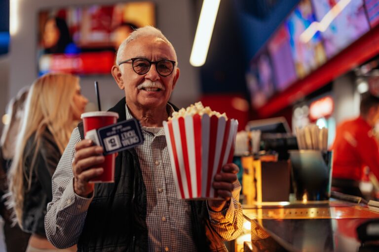 A,Senior,Joyful,Man,Is,At,The,Movie,Theater,,On