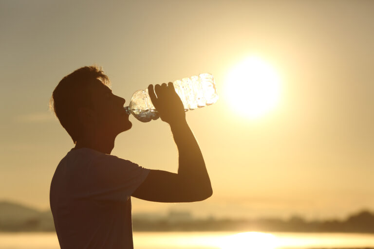 Profile,Of,A,Fitness,Man,Silhouette,Drinking,Water,From,A