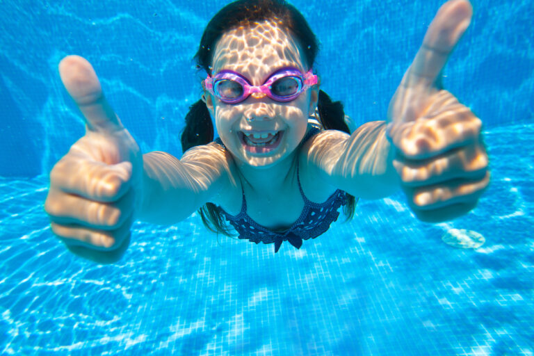 Little,Girl,Dives,Into,The,Water,And,Shows,The,Gesture