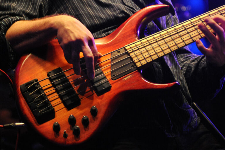 A,Basist,On,The,Streets,Of,Miami,Beach,Plucks,His