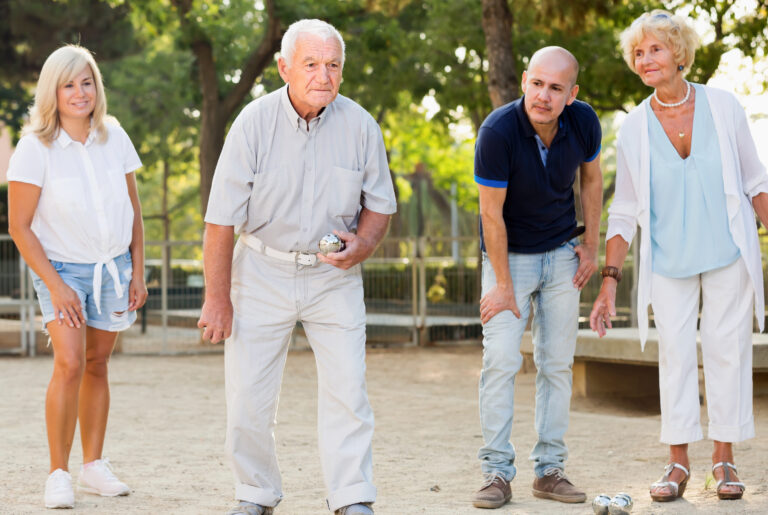 Positive,Mature,People,Friends,Playing,Petanque,In,Park,Outdoor
