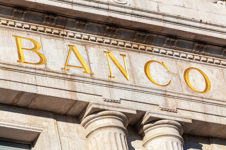 Word,Bank,In,Spanish,Sculpted,In,Stone,And,Golden,Color