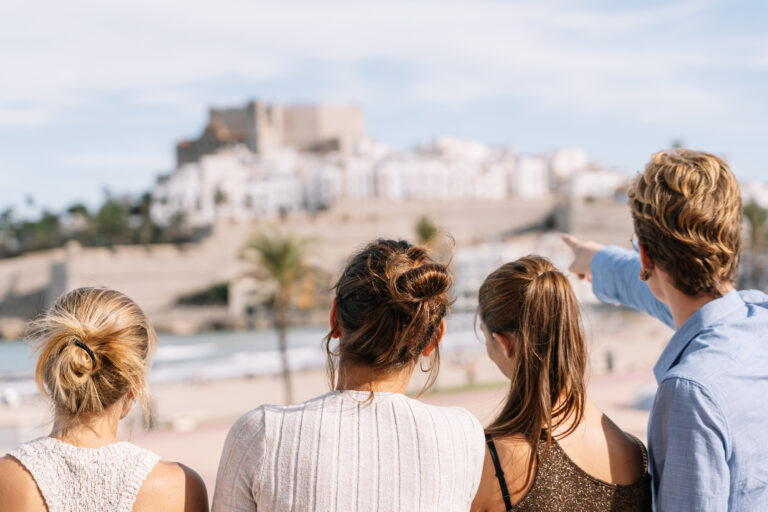 Group,Of,Friends,Looking,At,The,City,Of,Peniscola,During