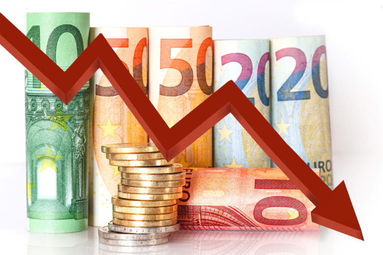 Euro,Banknotes,Standing,With,Coin,Tower,And,Red,Arrow,Going