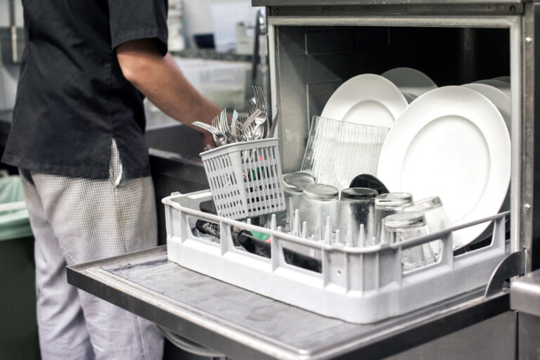 Kitchen,Hand,With,An,Open,Dishwasher,Filled,With,Clean,White