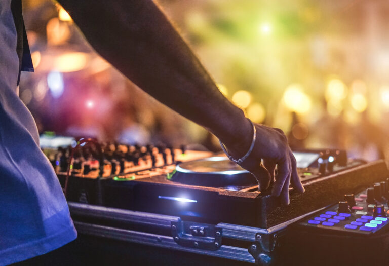 Dj,Mixing,Outdoor,At,Beach,Party,Festival,With,Crowd,Of