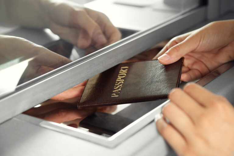 Woman,Buying,Tickets,With,Passport,At,Box,Office