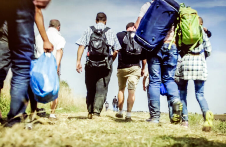 The,Refugees,Migrate,To,Europe.,Blurred,,Bokeh,Background,,Defocused