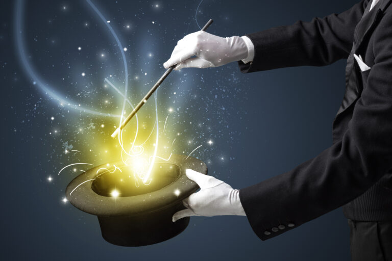 Magician,Hand,Conjure,With,Wand,Light,From,A,Black,Cylinder