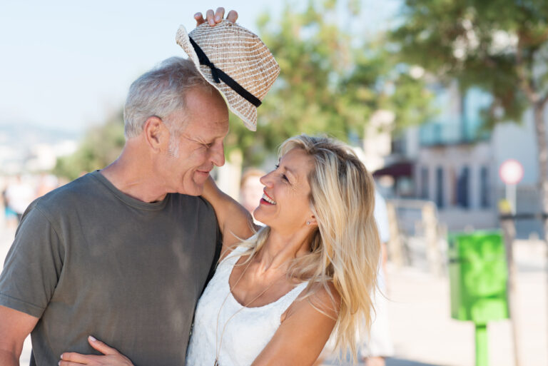 Laughing,Beautiful,Affectionate,Woman,Giving,Her,Husband,Her,Trendy,Hat