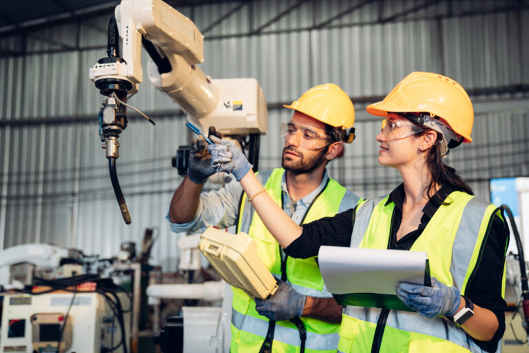 Team,Of,Engineers,Is,Controlling,Robot,Arm,Machine,Welding,Steel,