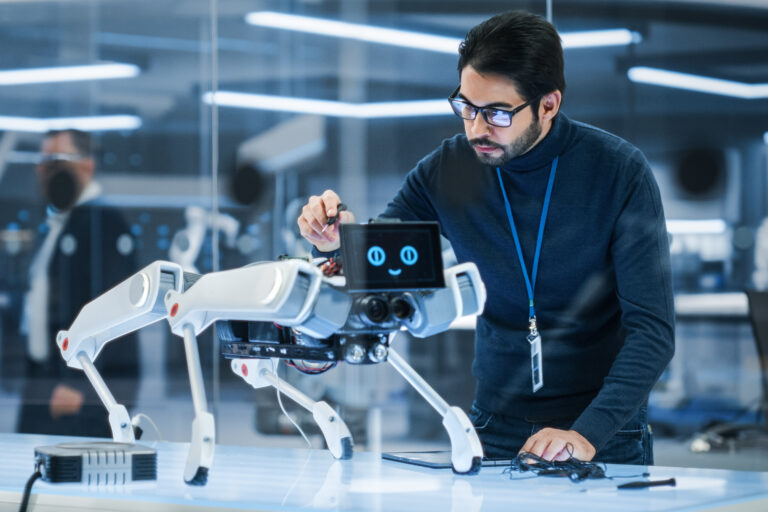 Portrait,Of,Hispanic,Engineer,Using,A,Screwdriver,While,Building,And