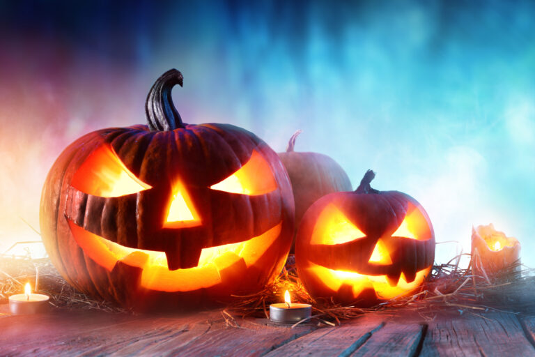 Halloween,Pumpkins,On,Wood,In,A,Spooky,Forest,At,Night