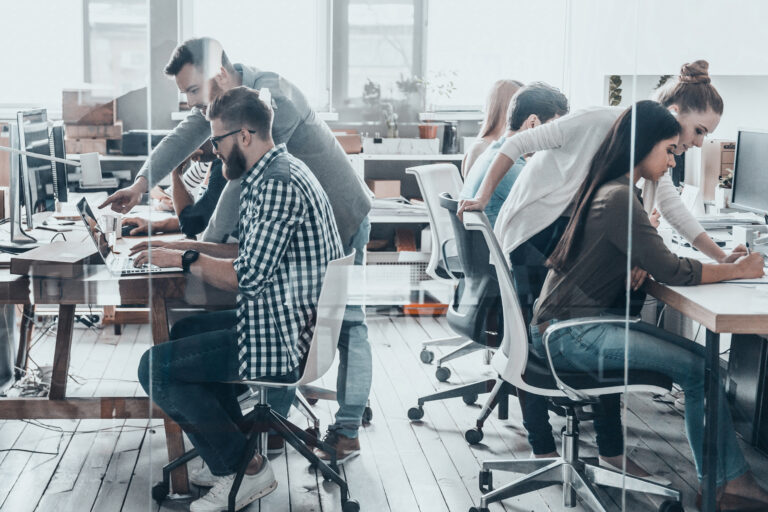 Discussing,Business,Issues.,Group,Of,Young,Business,People,Sitting,At