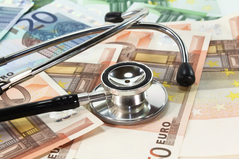 Black,And,Silver,Stethoscope,With,Many,Euro,Banknotes