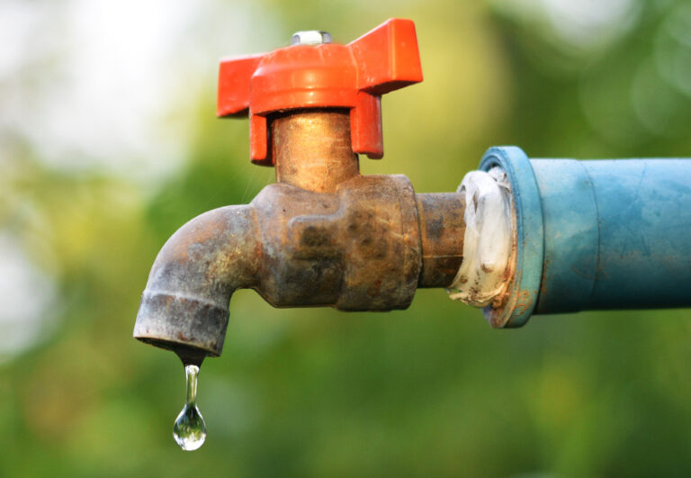 Brass,Water,Tap,In,Nature,Background.