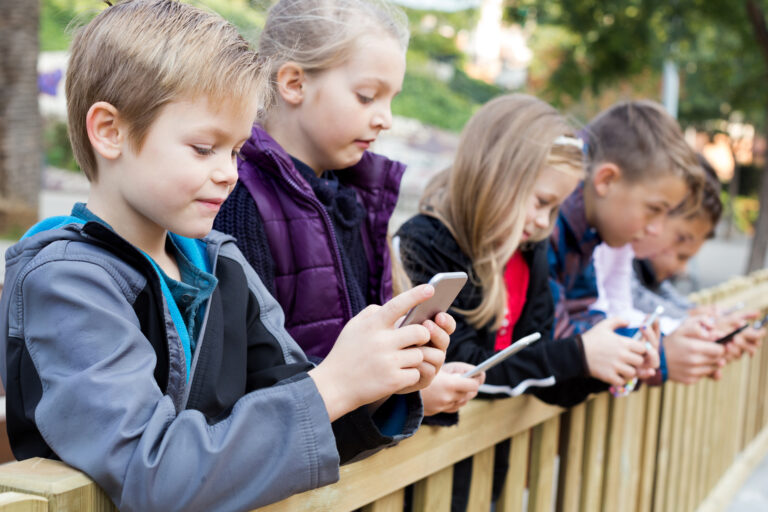 Preschool,Children,With,Tablets,In,Street