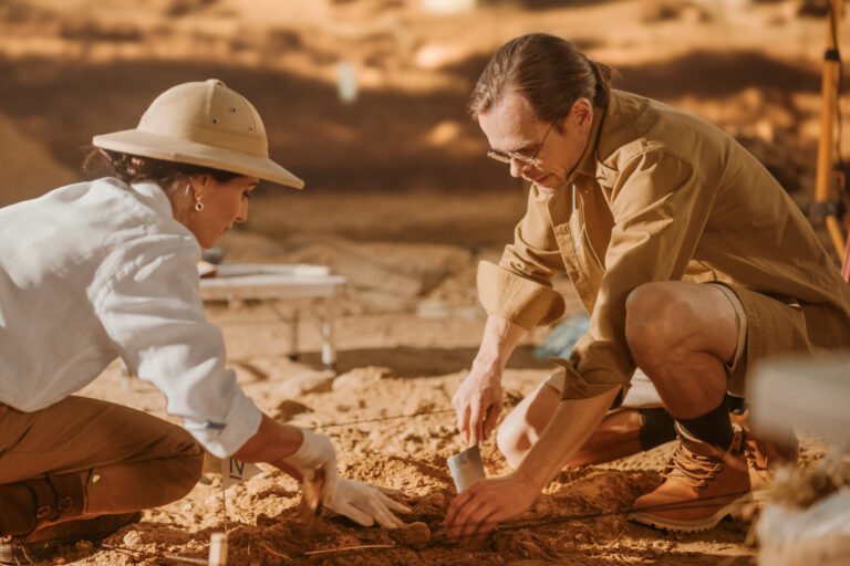 Archaeological,Digging,Site:,Two,Great,Archeologists,Work,On,Excavation,Site,
