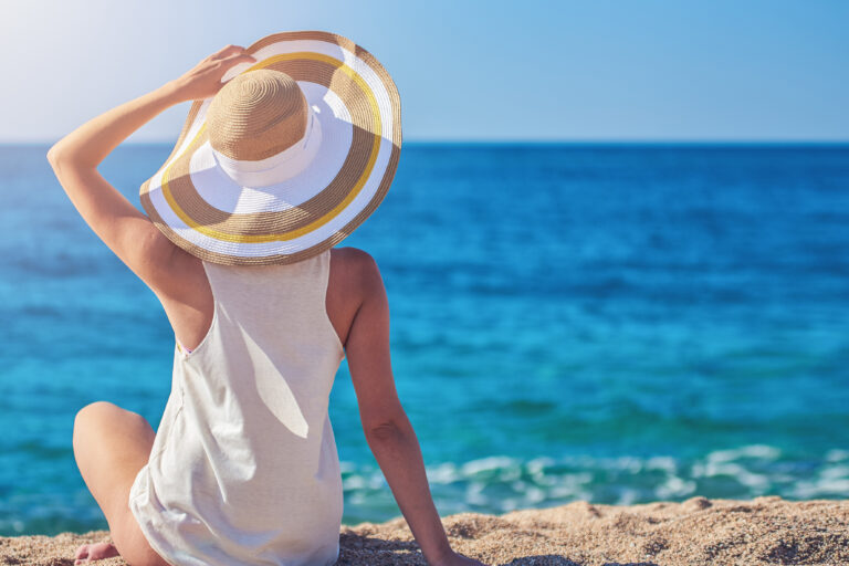 Young,Woman,Having,A,Rest,At,The,Seacoast.,She,Is