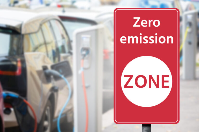 Road,Sign,"zero,Emission,Zone",On,A,Background,Of,Electric