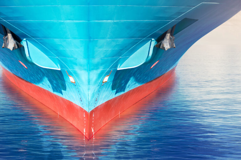 Front,View,Of,Large,Blue,Container,Cargo,Ship,In,The