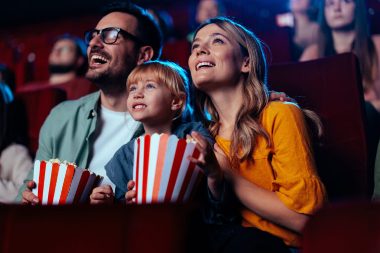 A,Young,Joyful,Couple,Is,With,Their,Daughter,In,The