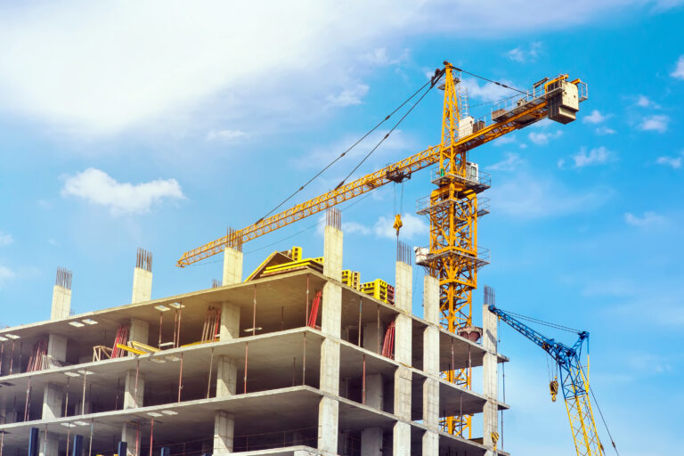 High,Yellow,Crane,Building,A,House,In,The,Beautiful,Bright