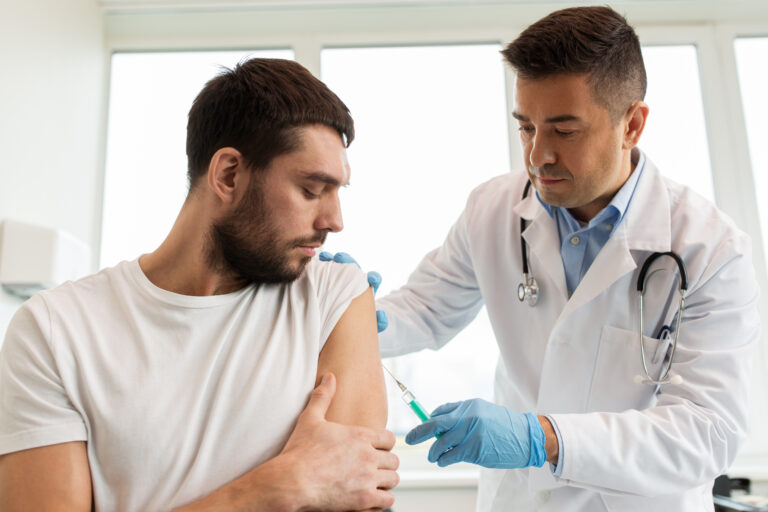 Medicine,,Vaccination,And,Healthcare,Concept,-,Doctor,With,Syringe,Doing