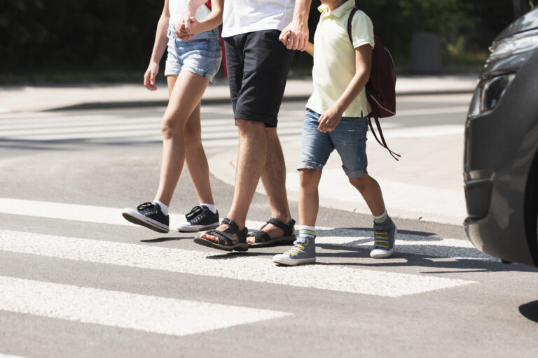 Children,Crossing,The,Street,With,Their,Father