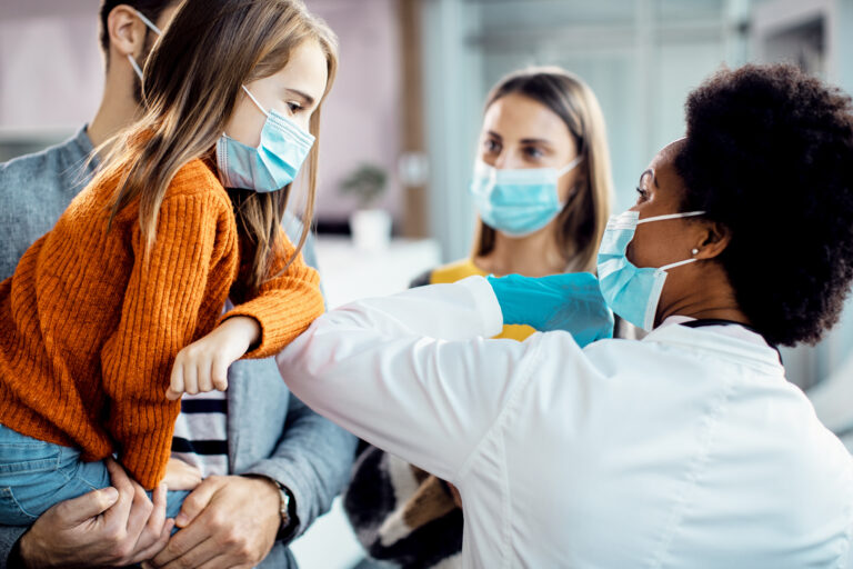 Small,Girl,Elbow,Bumping,With,A,Pediatrician,While,Greeting,At