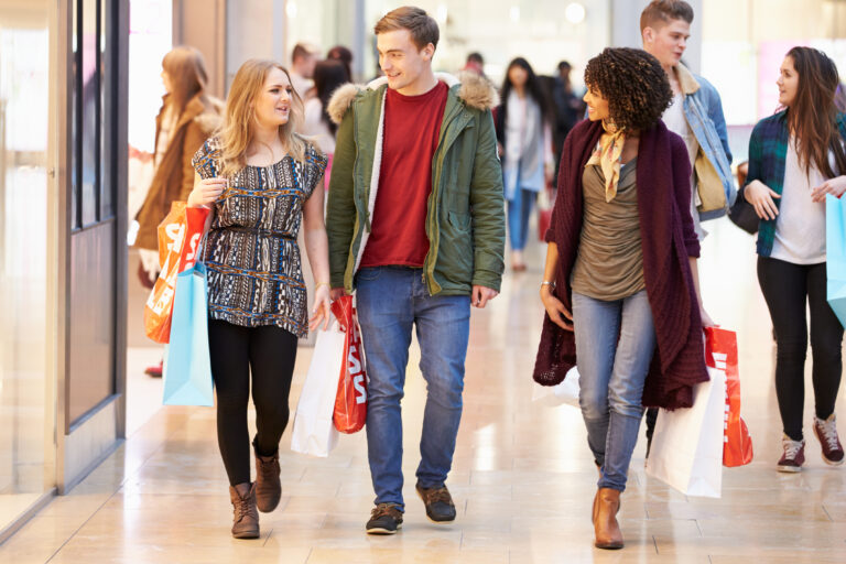 Group,Of,Young,Friends,Shopping,In,Mall,Together