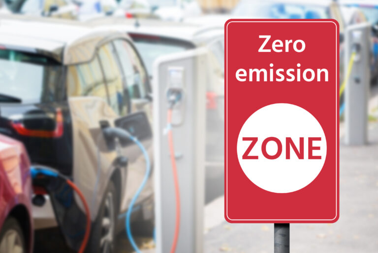 Road,Sign,"zero,Emission,Zone",On,A,Background,Of,Electric
