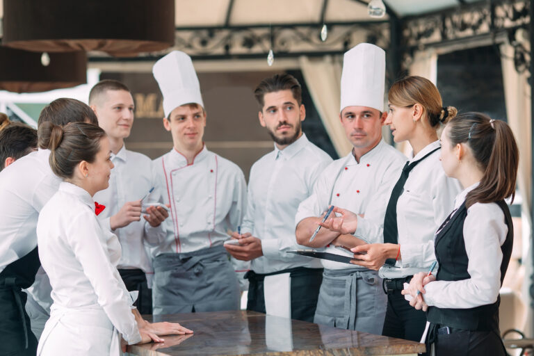 Restaurant,Manager,And,His,Staff,In,Terrace.,Interacting,To,Head
