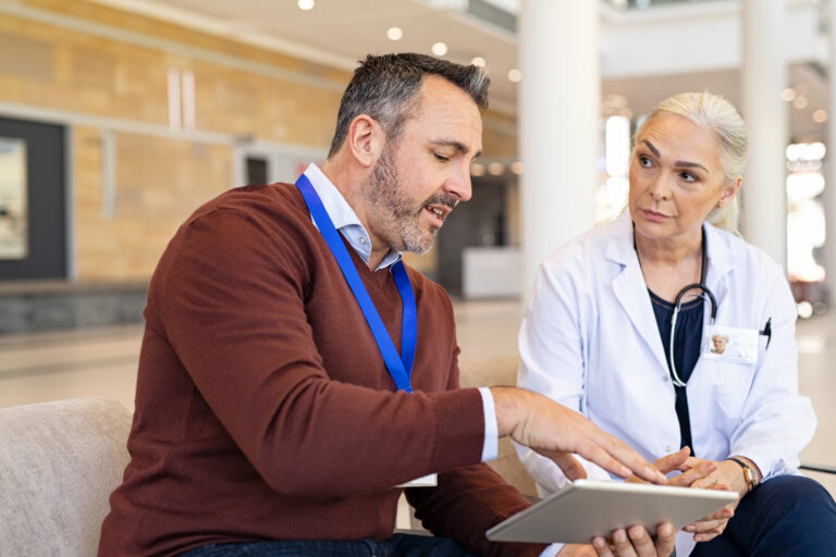 General,Practitioner,Discussing,Patient,Case,Status,With,His,Medical,Staff
