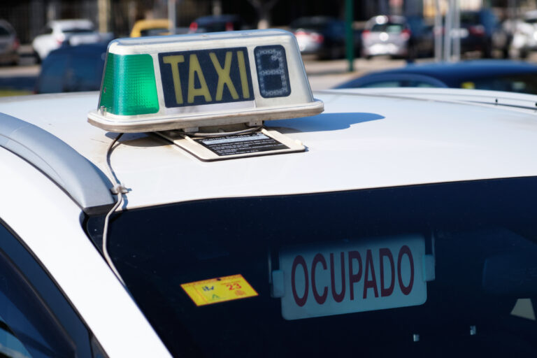M·laga,,Spain;,January,29,,2023:,Taxi,Sign,With,A,Placard