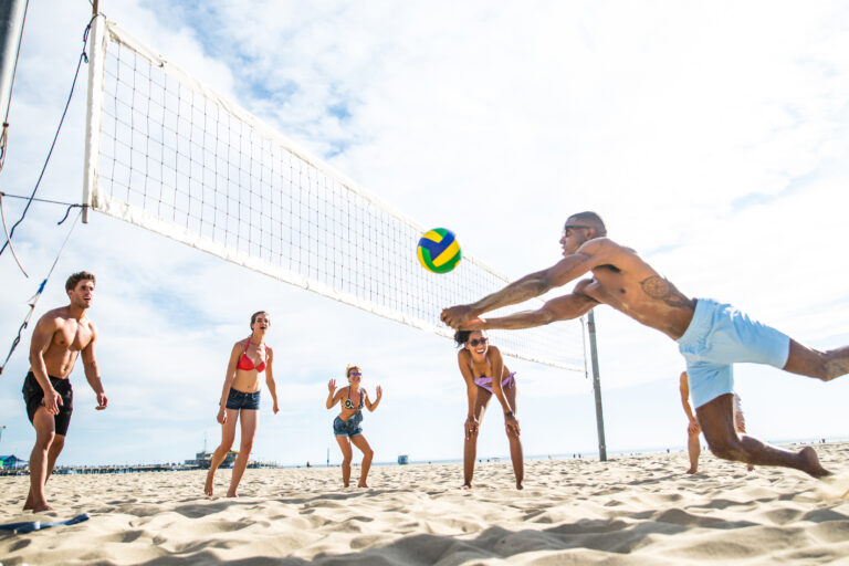 Group,Of,Friends,Playing,Beach,Volley,-,Multi-ethic,Group,Of