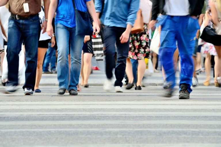Motion,Blurred,Pedestrians,Crossing,Sunlit,Street