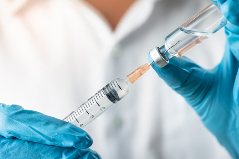 Doctor,,Nurse,,Scientist,,Researcher,Hand,In,Blue,Gloves,Holding,Flu,