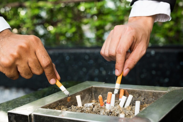 Close,Up,Hand,Businessman,Two,Person,Cigarettes,For,Smoking,Stand