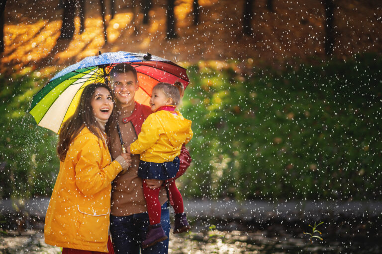 Happy,Funny,Family,With,Colourful,Umbrella,Under,The,Autumn,Rain.
