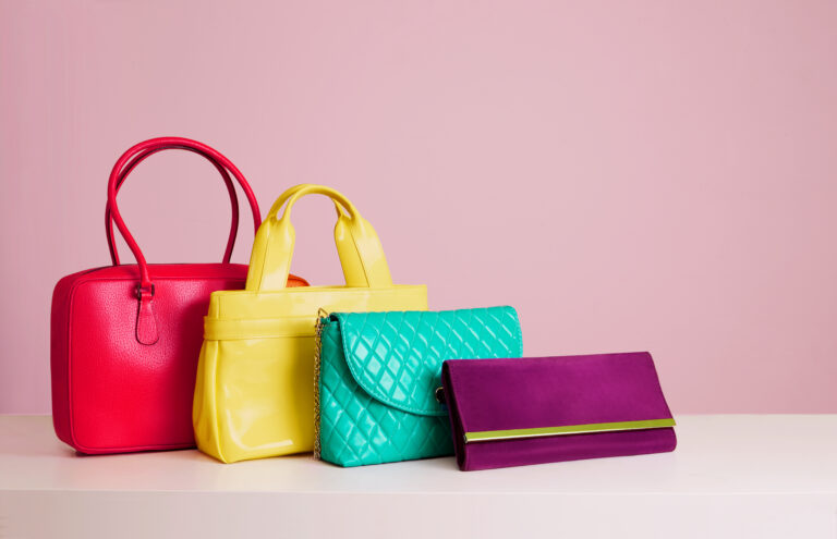 Colourful,Woman,Bags,On,Pink,Background