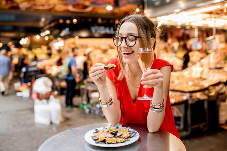 Young,Woman,In,Red,Dress,Having,Lunch,With,Mussels,And