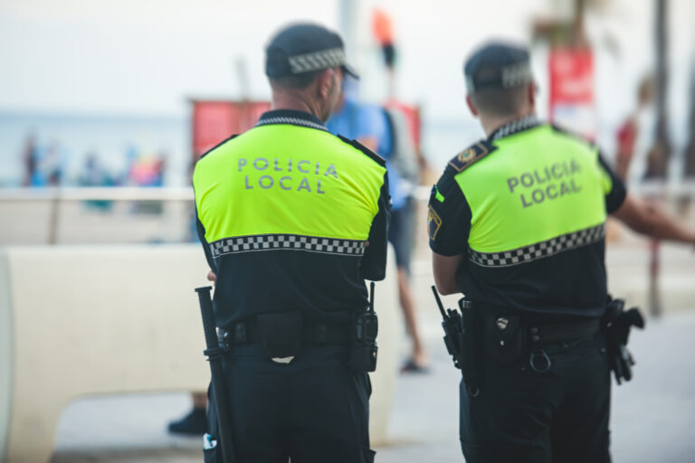 Spanish,Police,Squad,Formation,Back,View,With,"local,Police",Logo