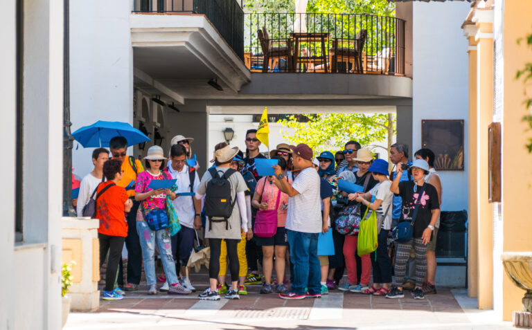 Mijas,,Spain,,June,28,2017:,Chinese,Tourists,Guided,Through,The