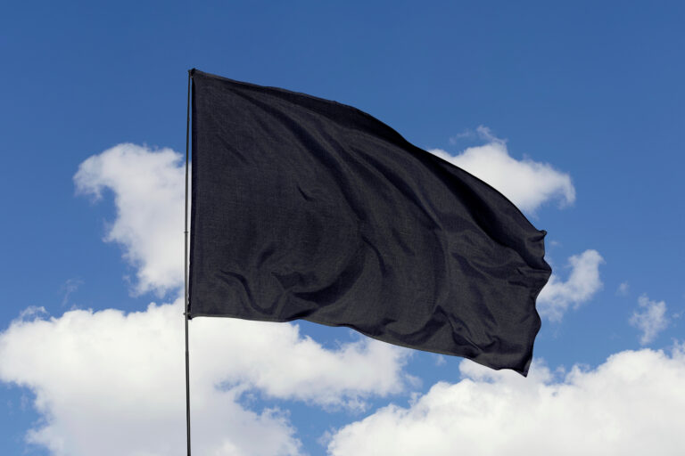 Flag,Isolated,On,Sky,Background,With,Clipping,Path.,Black,Flag