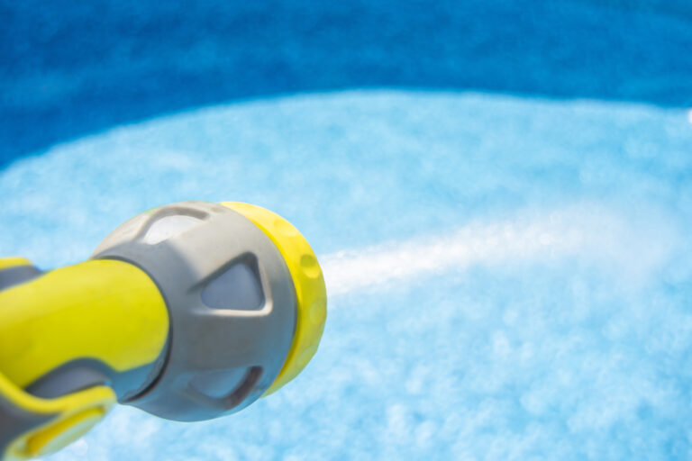 Filling,The,Water,Into,An,Empty,Swimming,Pool,By,Garden