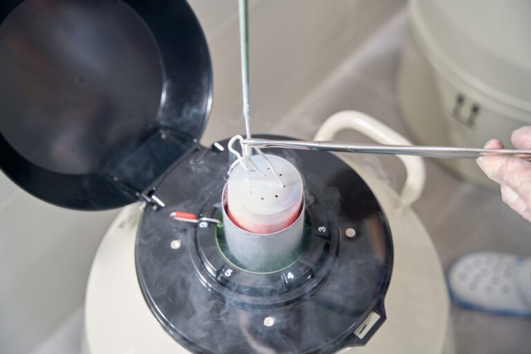 Health,Worker,Puts,Biomaterial,Into,A,Tank,With,Liquid,Nitrogen