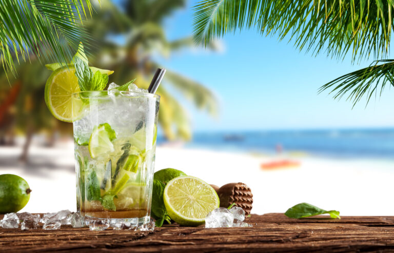 Summer,Cocktail,With,Blur,Beach,On,Background